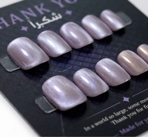 Moonlit smoke cat-eye nails and soft glam styling